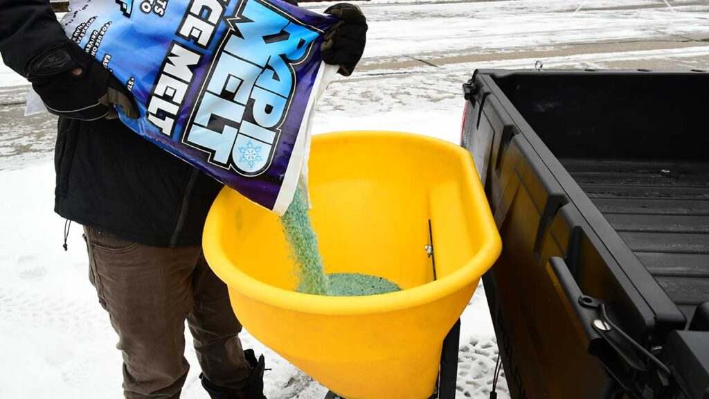 Pouring Salt Into Utility Tailgate