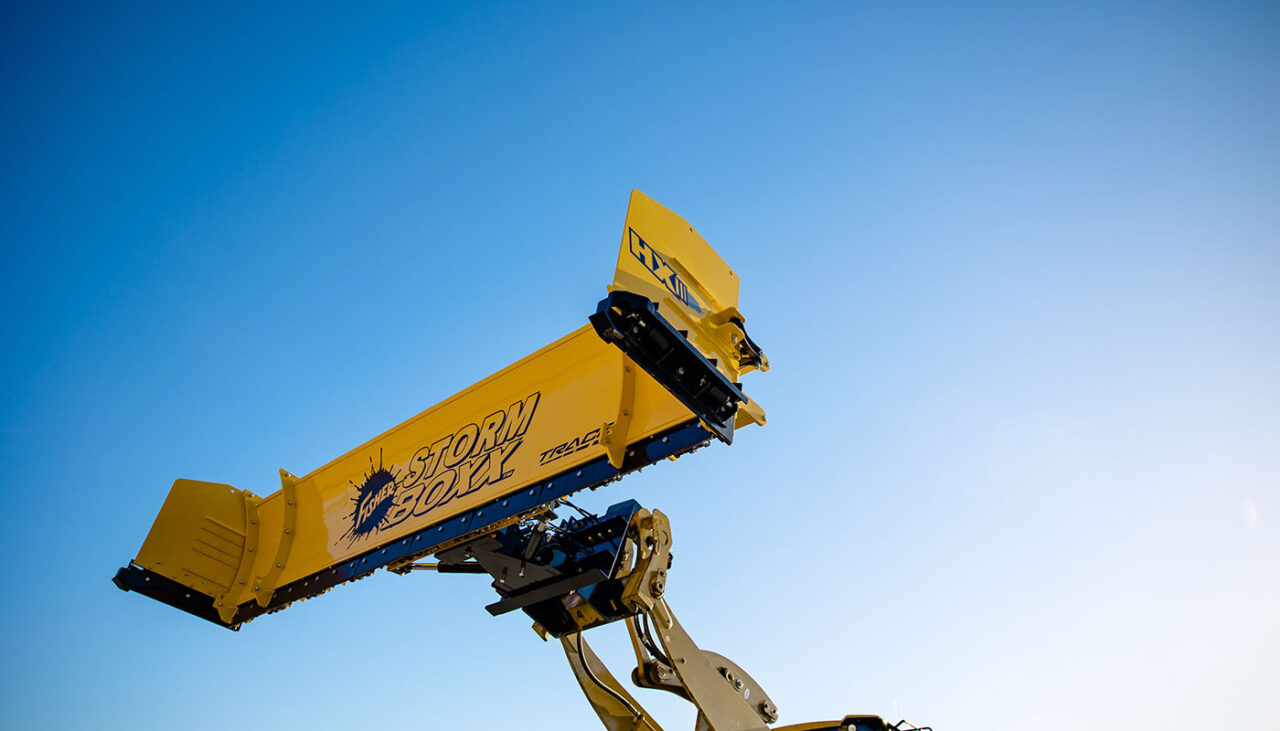 FISHER STORM BOXX HX pusher plow with hydraulic wings lifted in air